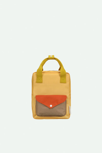 backpack small | envelope | apple juice