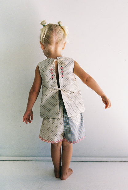 Della Short | blue check