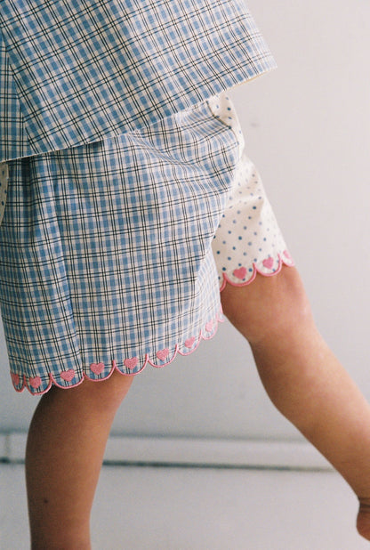 Della Short | blue check